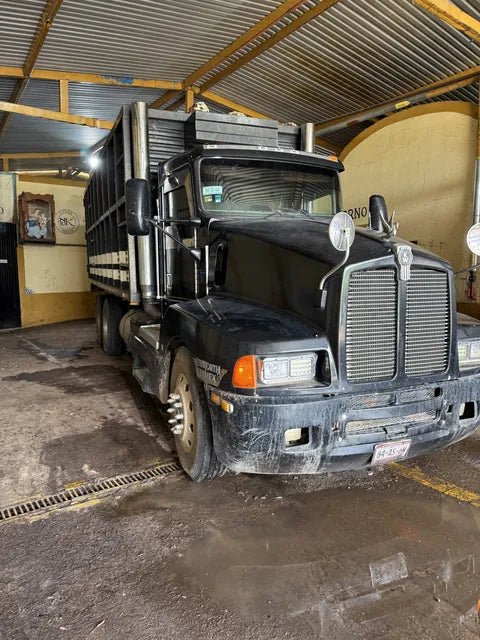A loaded agave truck parked inside the yard at Destiladora Refugio