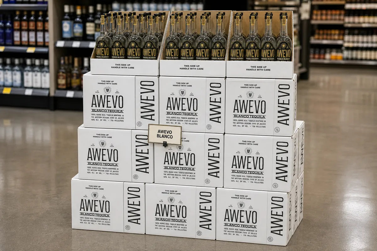 Larger stack of white Awevo cases with a row of bottles on top