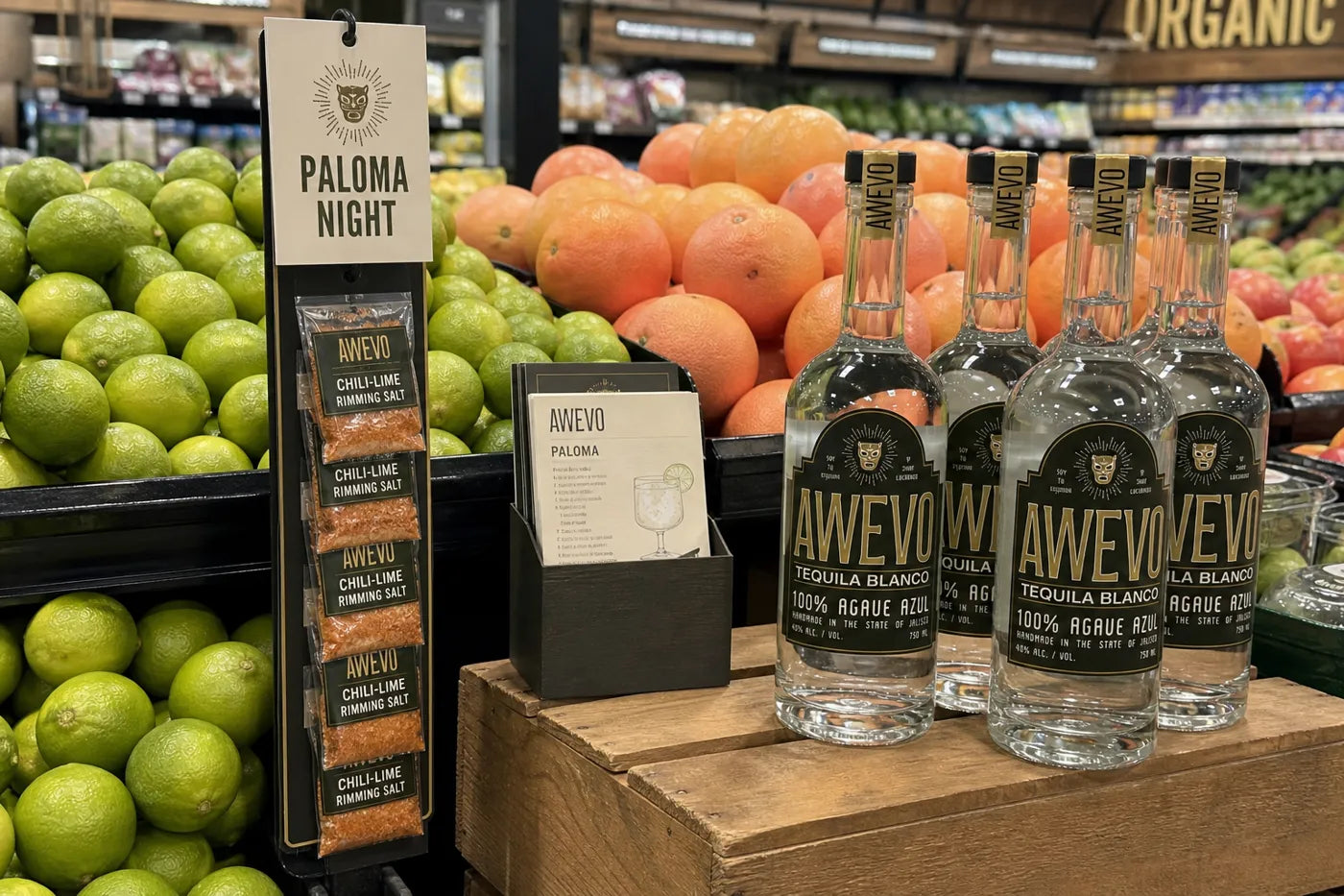 Awevo Paloma display with grapefruits and limes in the produce section